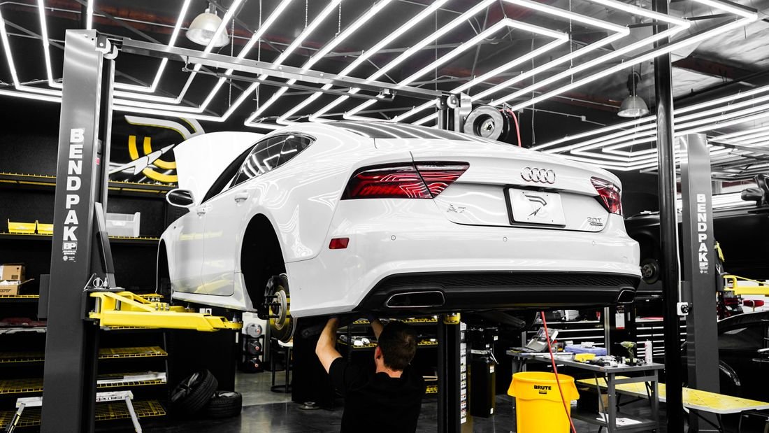 AXLON Autos technician servicing a vehicle in the workshop