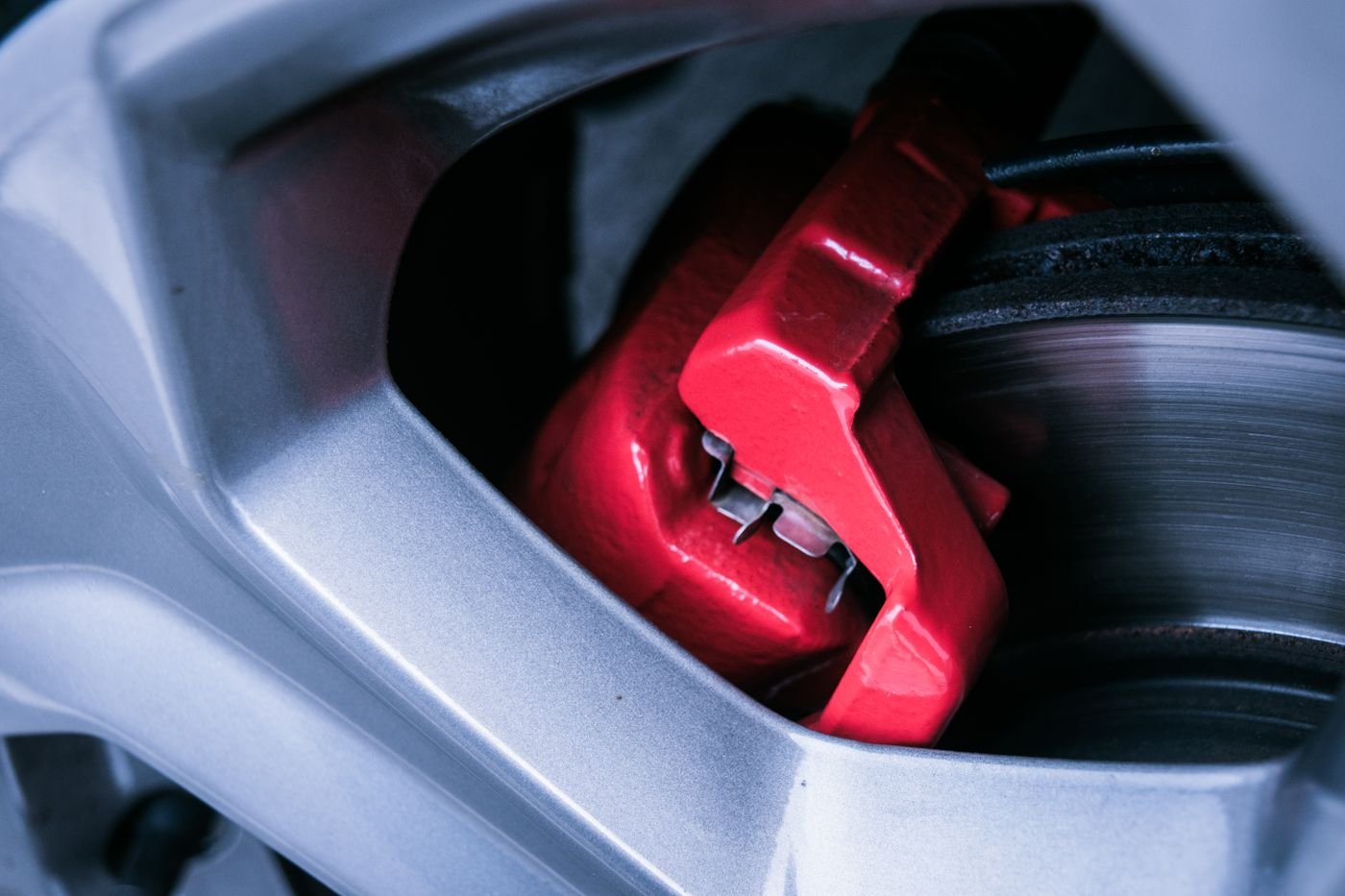 Close-up of a car brake caliper and disc