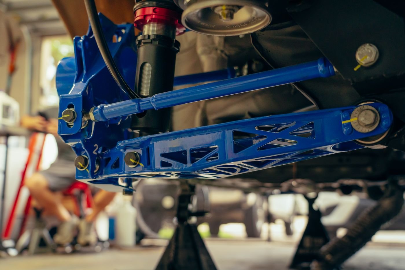 Vehicle shock and suspension part in an auto garage